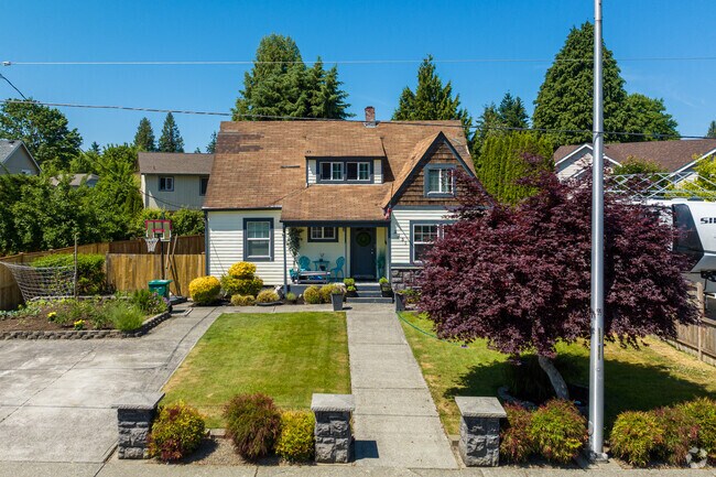 A cottage-style home in South Auburn sits across from a high school.
