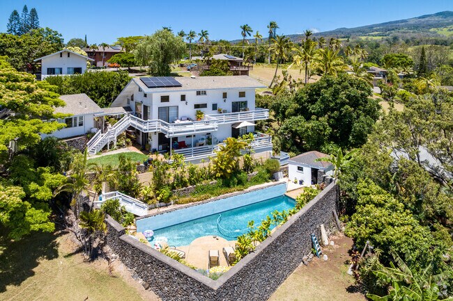 Homes in Makawao often overlook rolling green hills and valleys.