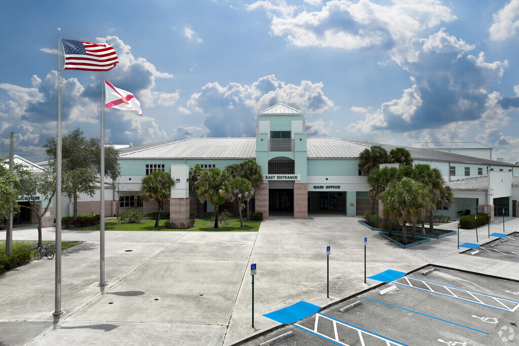 Royal Palm Beach High School front main entrance with flags.