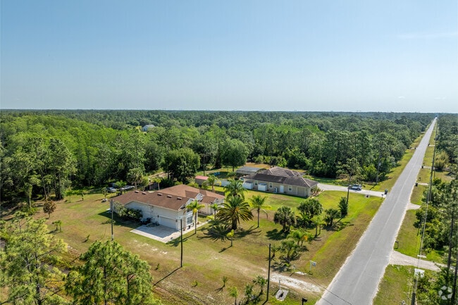 Large lots with mature trees offer opportunities to build your dream home in Wedgefield.