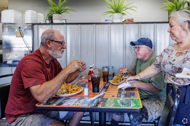 Friends sit down for a meal at the Joplin Cafe just outside Cecil Floyd.