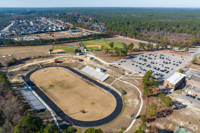 You can see the large football field, track and other fields at Pine Forest High School.