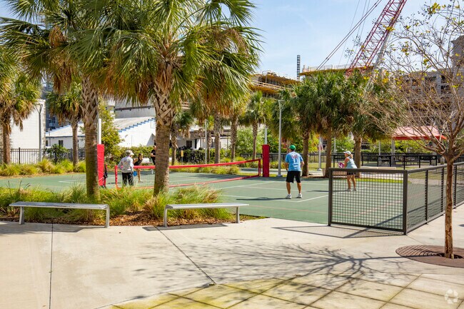 Play a friendly game of pickleball at Madison Street Park in Channelside, FL.