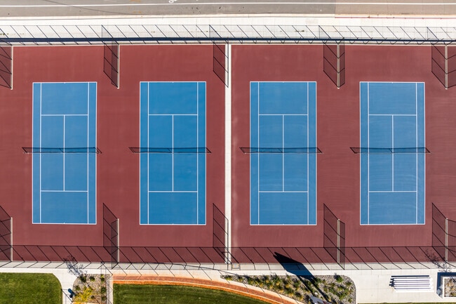 Blue sports courts surrounded by red at Ben Lomond High School.