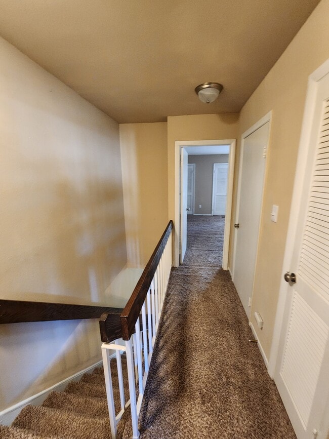 2BR, 2.5 bath- 1,301 sq ft hallway upstairs with two hall closets