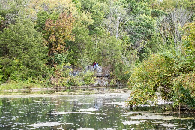Visitors enjoy the scenic vistas atop rock bluffs at Sequiota Park.