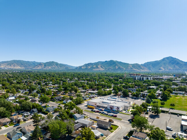 Green trees and mountains surround Roosevelt Continuation School.