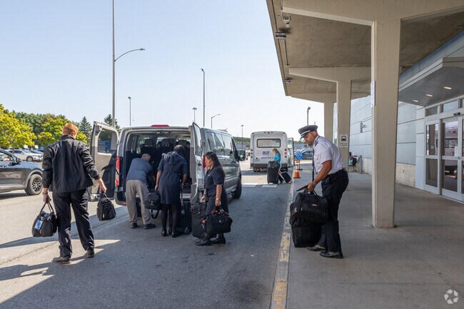 A crew arrives for their next flight at Bangor International Airport in West Side Village.