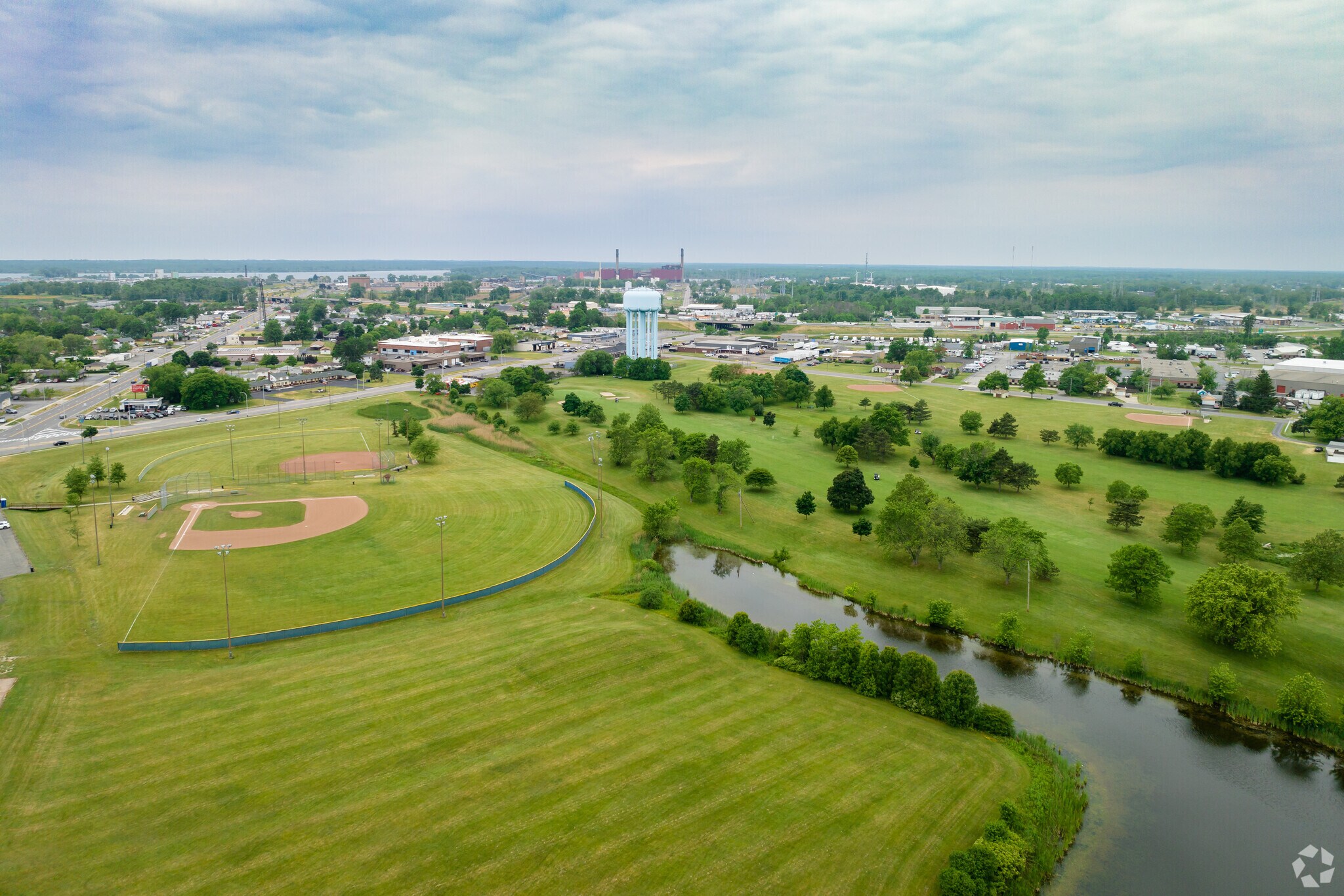There are baseball diamonds on the west side of Sheridan Park.