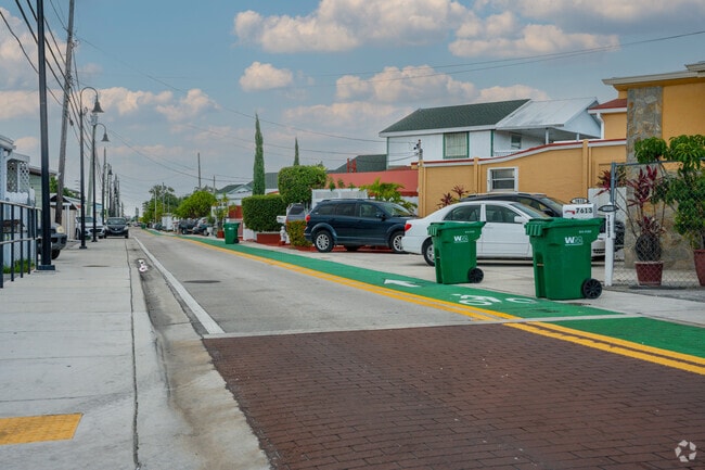 Bike-friendly streets are lined with a row of small two-story homes.