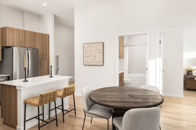 Quartz countertops with designer tile backsplashes at The Madison.