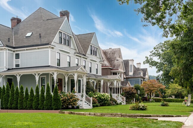 A row of Victorian duplexes faces a quiet street in Glen Osborne.