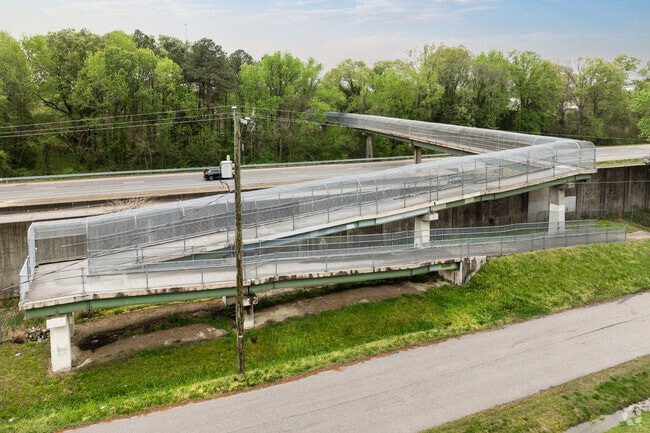 A walking bridge connects Glenrock to nearby neighborhoods across the highway.