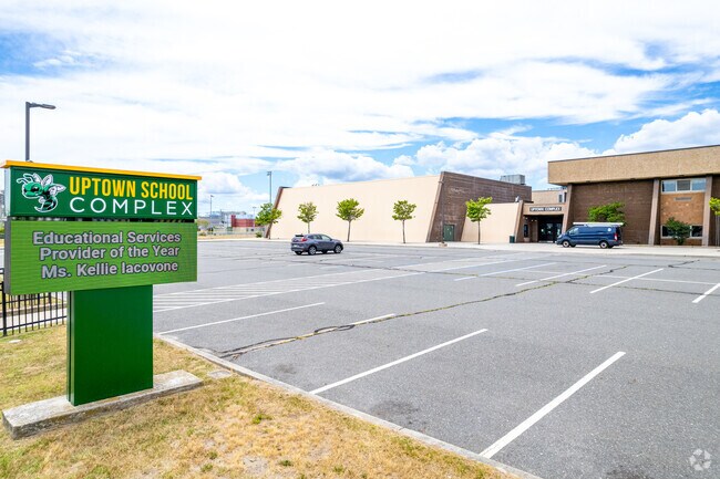 Children become students at Uptown Complex School.