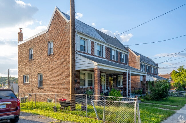 Older brick row homes with porches are common throughout Northeast DC.