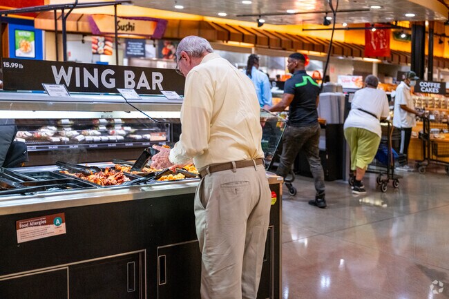 Near Greater Landover, Wegman's food bar is full of lunch options like wings, pizza and salads.