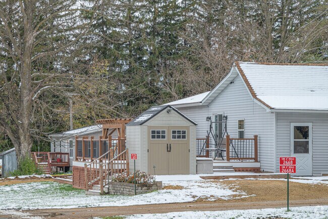 Find modest homes shaded by trees in Emerald.