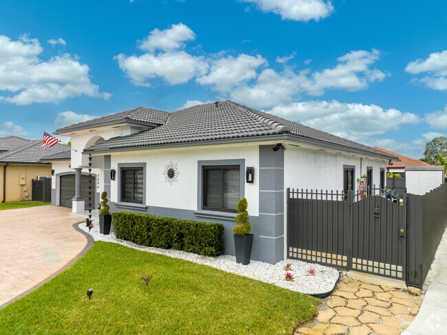 The Amelia District in Miami, FL has plenty of single-family homes with green lawns.