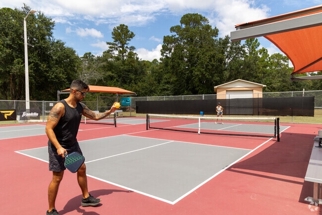 Some Holley Pickle Ball player enjoy a volley at Lenny James Tolbert Memorial Park.