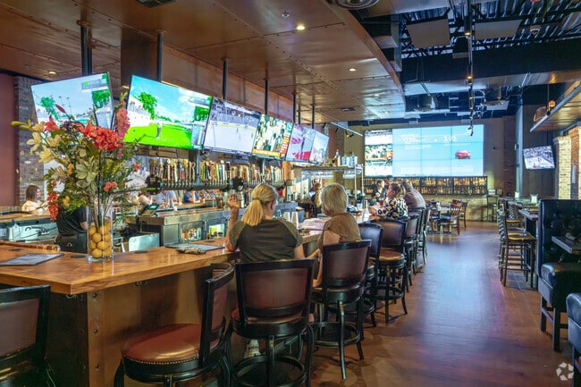 The bar at Lambeau's is where residents can watch sports in  Highland Village.