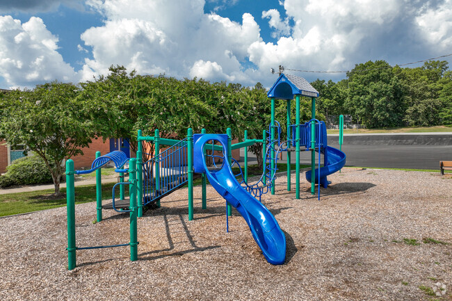 Playground equipment with slide for recess usage.