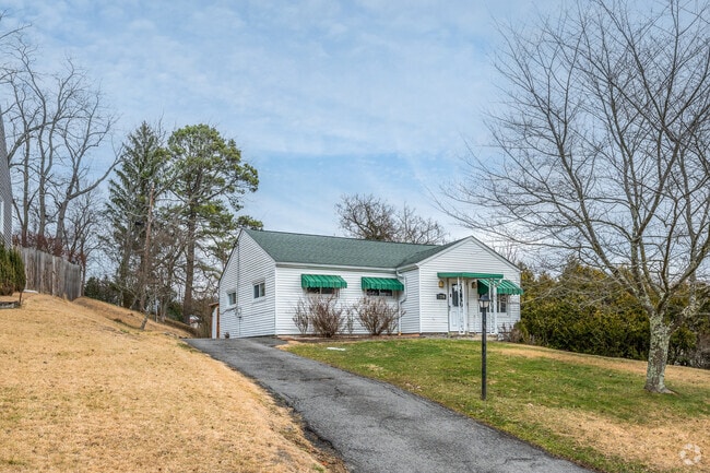 A quaint ranch sits on a raised lot in Fairmont.