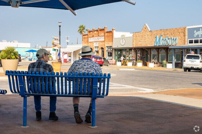 Two gentleman enjoy the day roam the shops and food spots of Rockport.