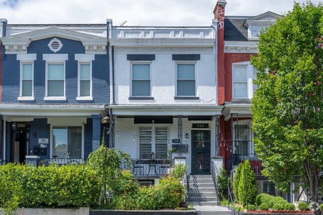 A row homes with a porch on Summit Pl NE in Eckington.