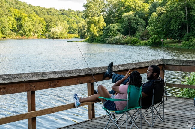 Residents of Warren spend a relaxing evening fishing at Mill Creek Park.