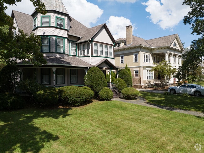 A Victorian next to a Georgian styled home in Forest Park.