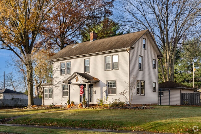 An early to mid 20th century Colonial Revival style home with a large lot in Mayflower Village.
