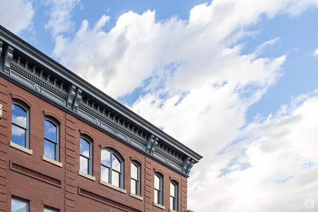 The sky gleams against downtown apartment windows in Boulder.