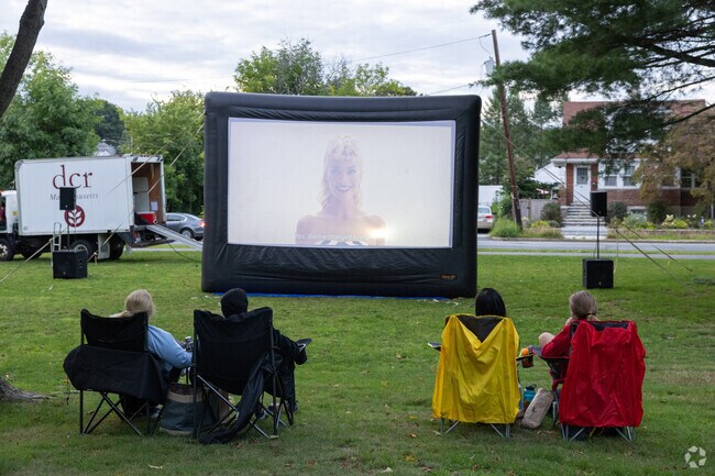 Snag a spot close to the screen for a fun night out at Free Family Flicks.