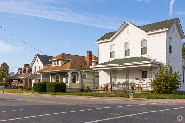 Well‑kept colonial homes appear on maintained streets in Harrison.
