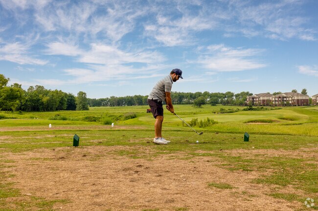 A golfer prepares for the perfect shot in the scenic Battle Creek neighborhood's golf course.