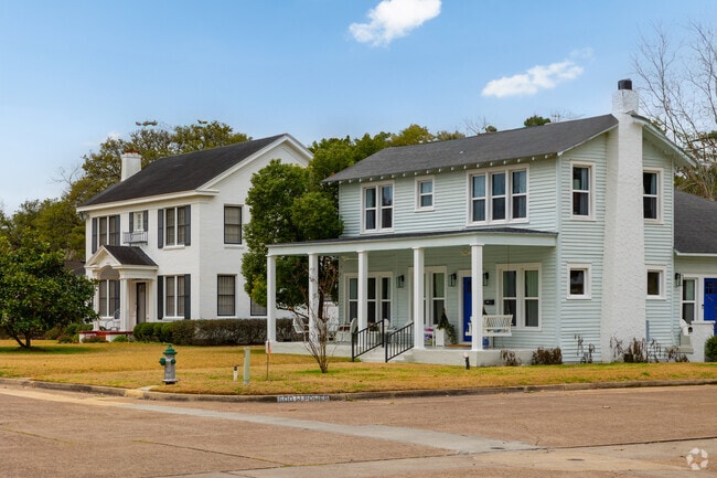 A row of historic two-story homes found in the Historic Heritage District of Victoria.