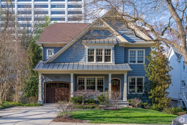 The streets in Chevy Chase Village are lined with sidewalks and mature trees.