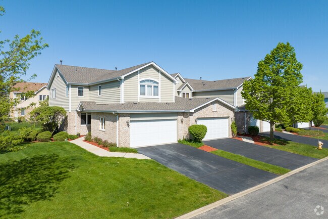 Brookside Glen subdivision townhomes have well manicured lawns and foliage.