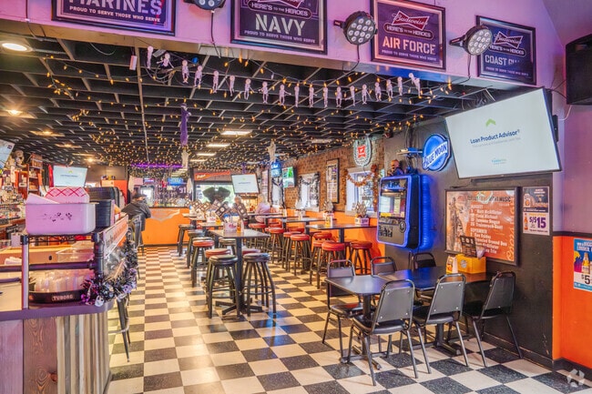 Military-themed decor and cozy seating fill the interior of Knuckleheads.