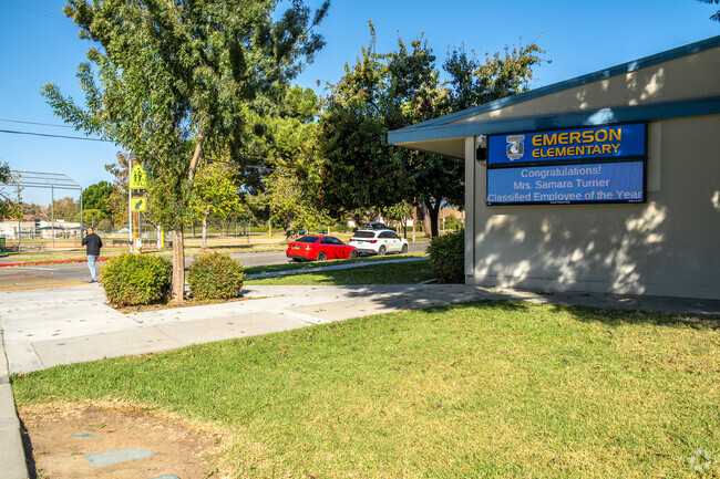The signage of Emerson Elementary School offers essential information and a warm welcome.