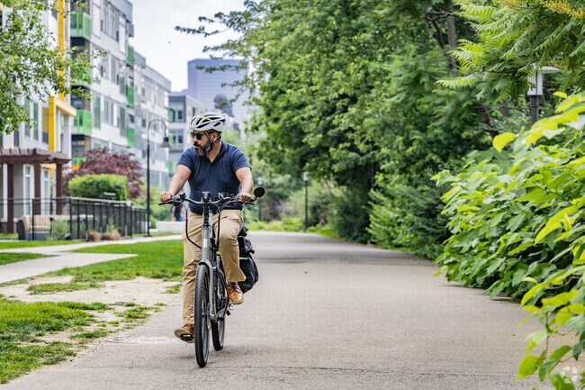 Commuters enjoy easy access along the river on the Strip District Trail in the Strip District.