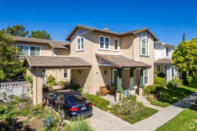 Single-family homes in University Park and Town Center sit on well-maintained yards and sidewalk-lined streets.