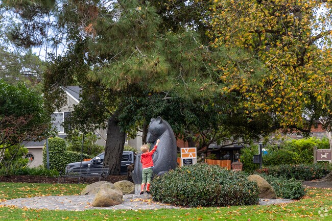 Bear mama and her two Cubs sits in the center of Crocker Park in Central Piedmont..