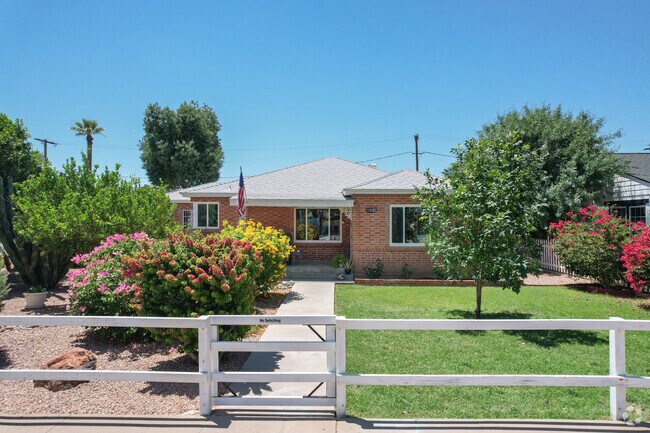 Colorful plants surround this brick home in the Temple neighborhood.