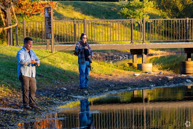 Residents enjoy the fishing pond at Middleton-Mills Park in Ryland Heights.