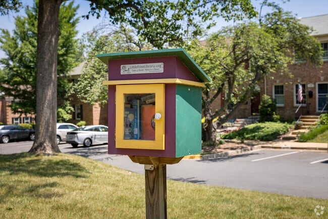 A take-a-book, leave-a-book book exchange in Merrifield fosters a tight-knit community.