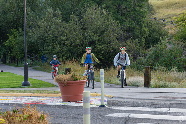 South Central children enjoy getting around the neighborhood on their bicycles.