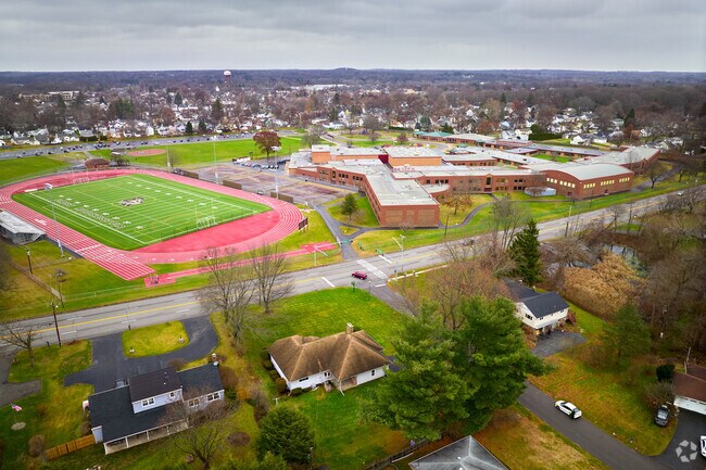 Autumn view of East Rochester Junior Senior High School and athletic fields.