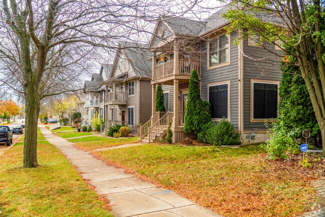 A row of homes in Halyard Park has double-decker porches and small front lawns.