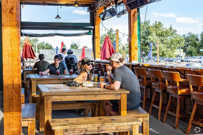 Meet friends for a drink on the patio at Barrels & Bottles Brewery in West Pleasant View.